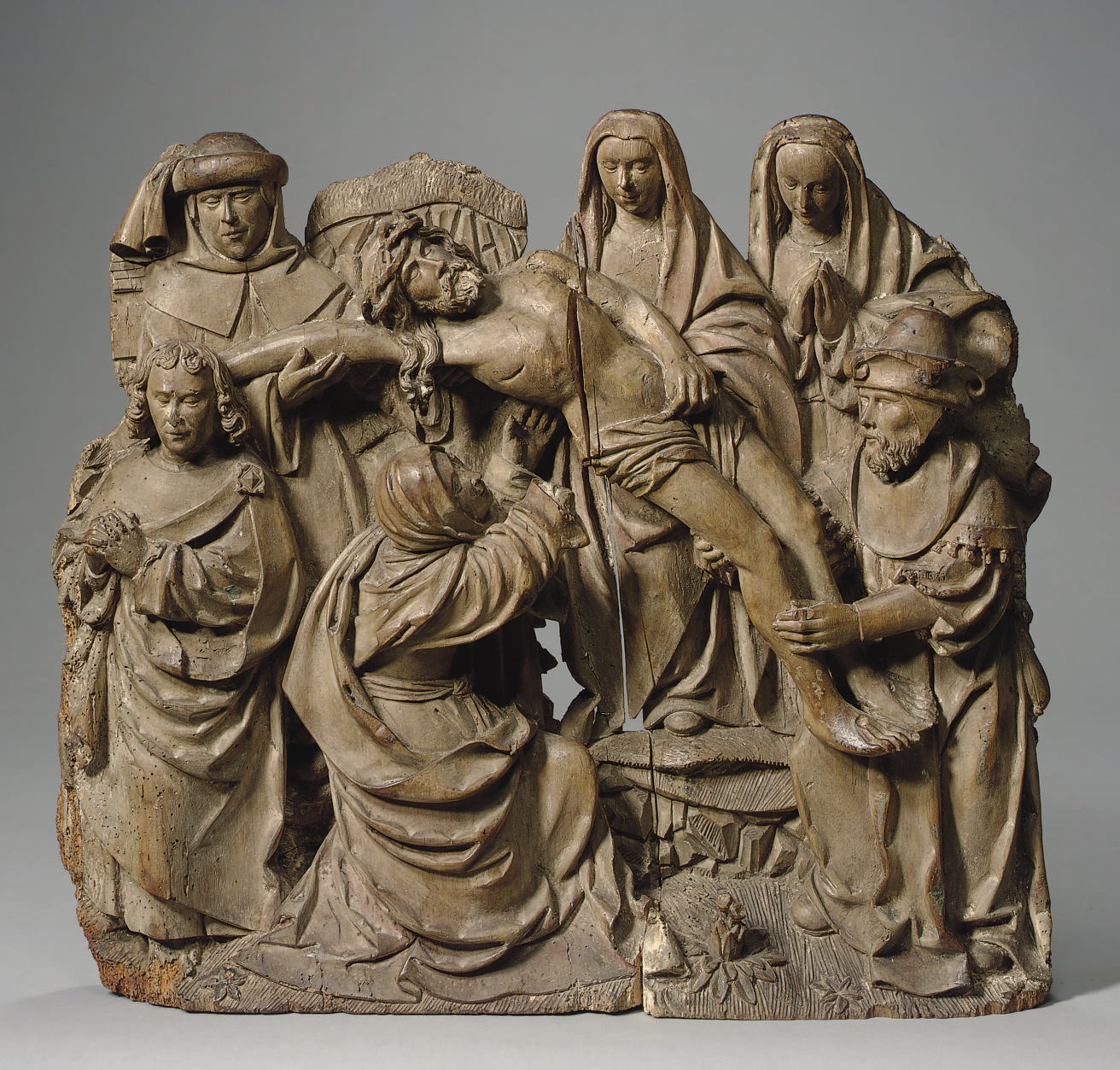 A CARVED LIMEWOOD RELIEF OF THE DEPOSITION