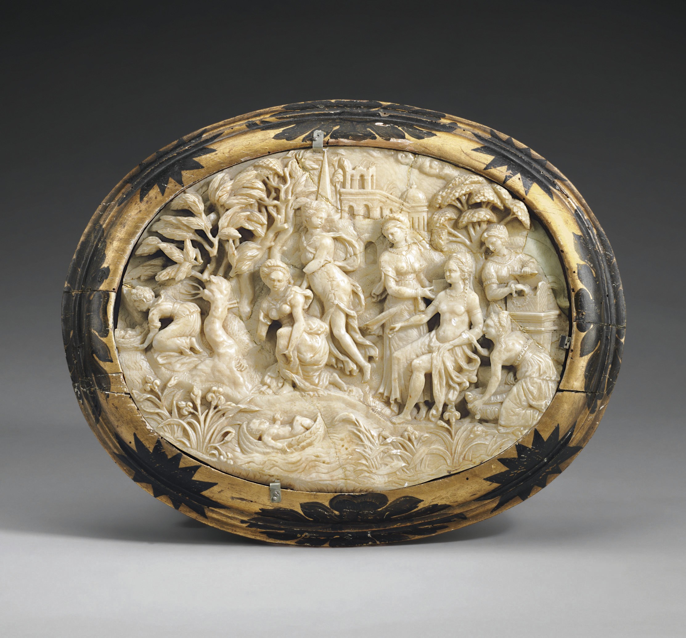 AN OVAL ALABASTER RELIEF DEPICTING THE FINDING OF MOSES