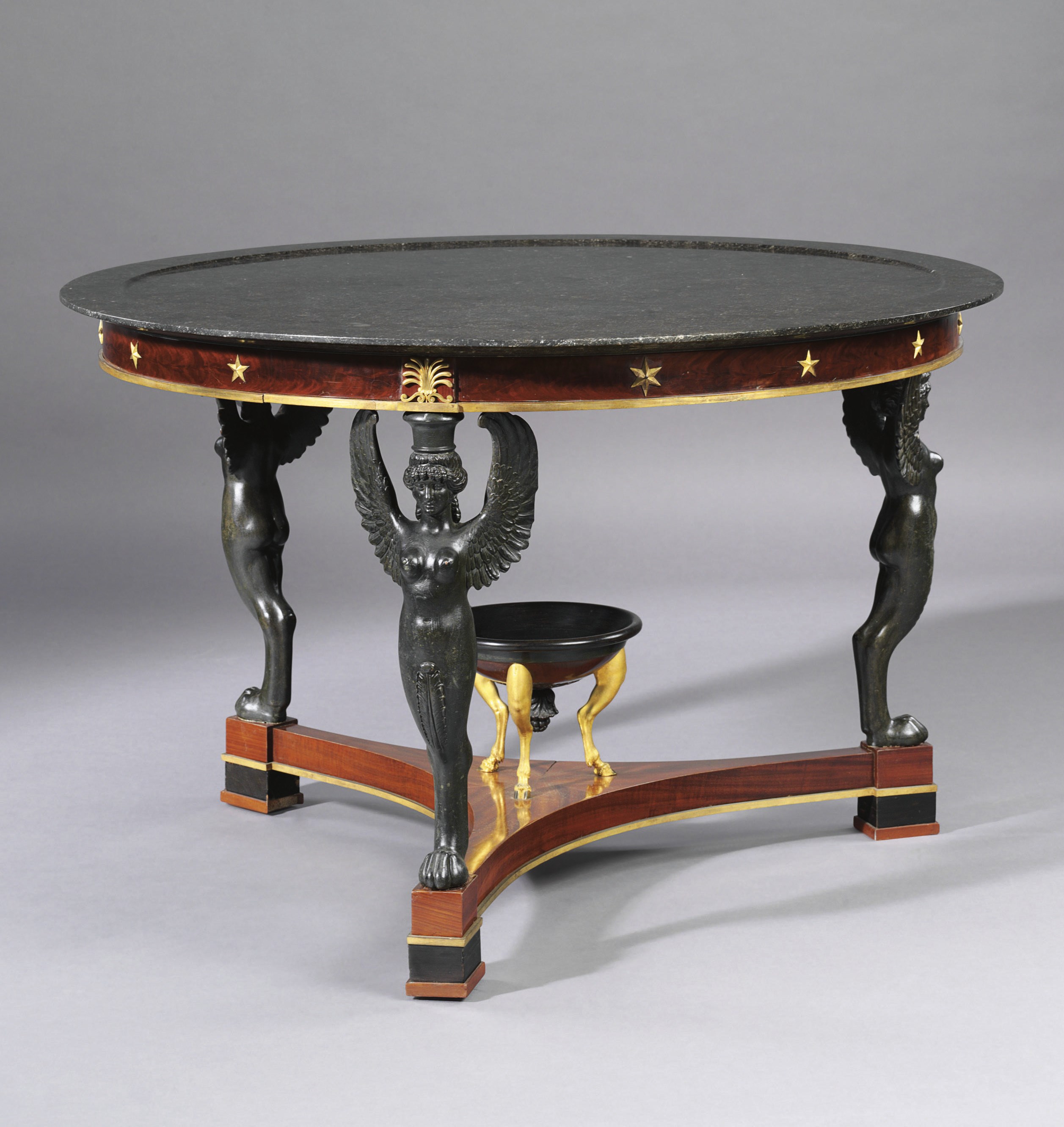 AN EMPIRE ORMOLU-MOUNTED, MAHOGANY, BRONZED, AND PARCEL-EBONIZED CENTER TABLE