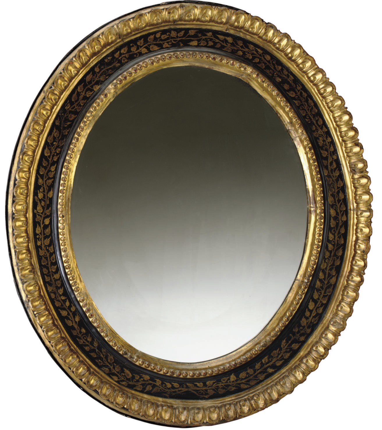 AN ITALIAN EBONIZED AND GILTWOOD MIRROR