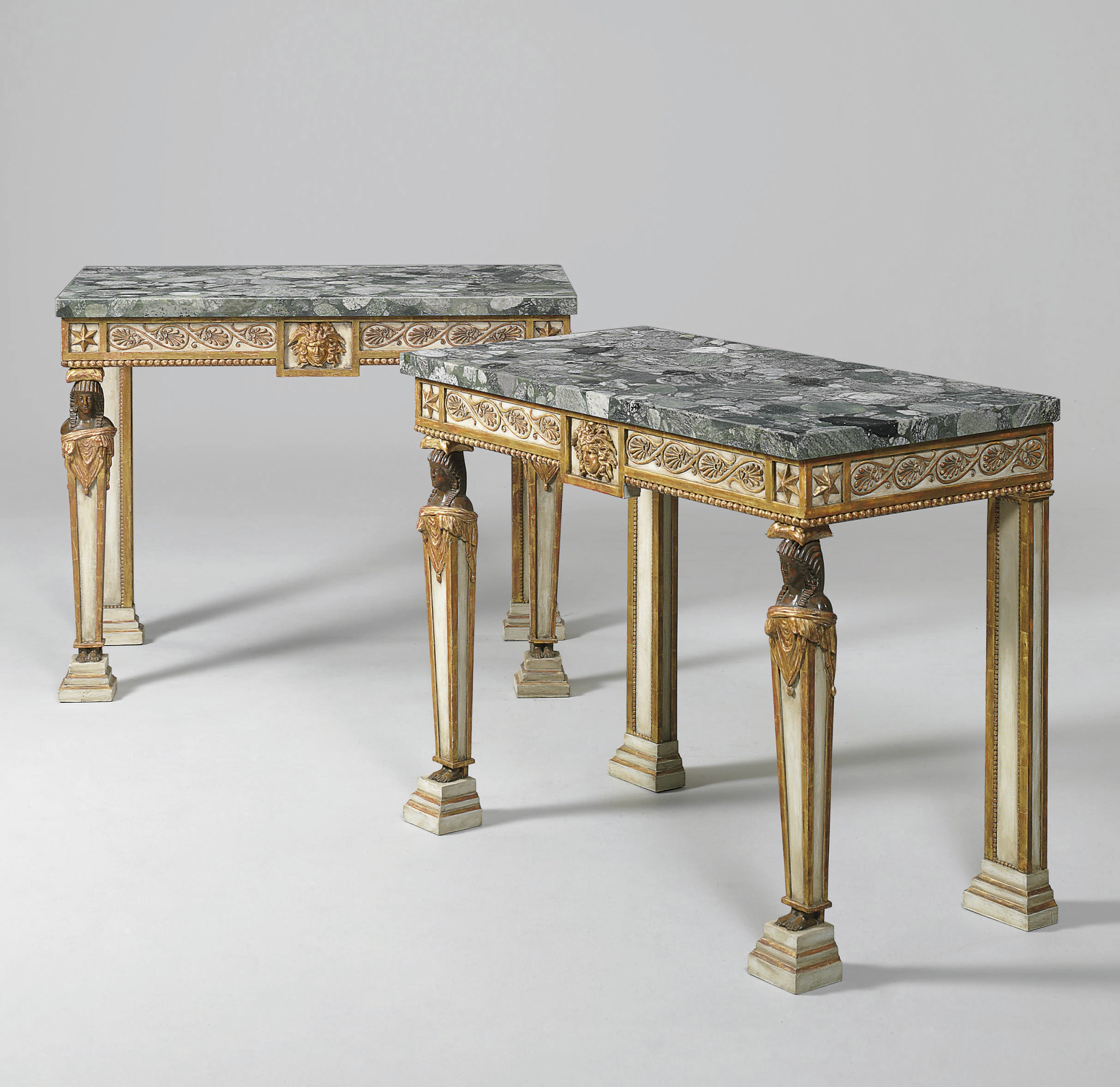 A PAIR OF ITALIAN OR GERMAN WHITE-PAINTED AND PARCEL-GILT CONSOLE TABLES
