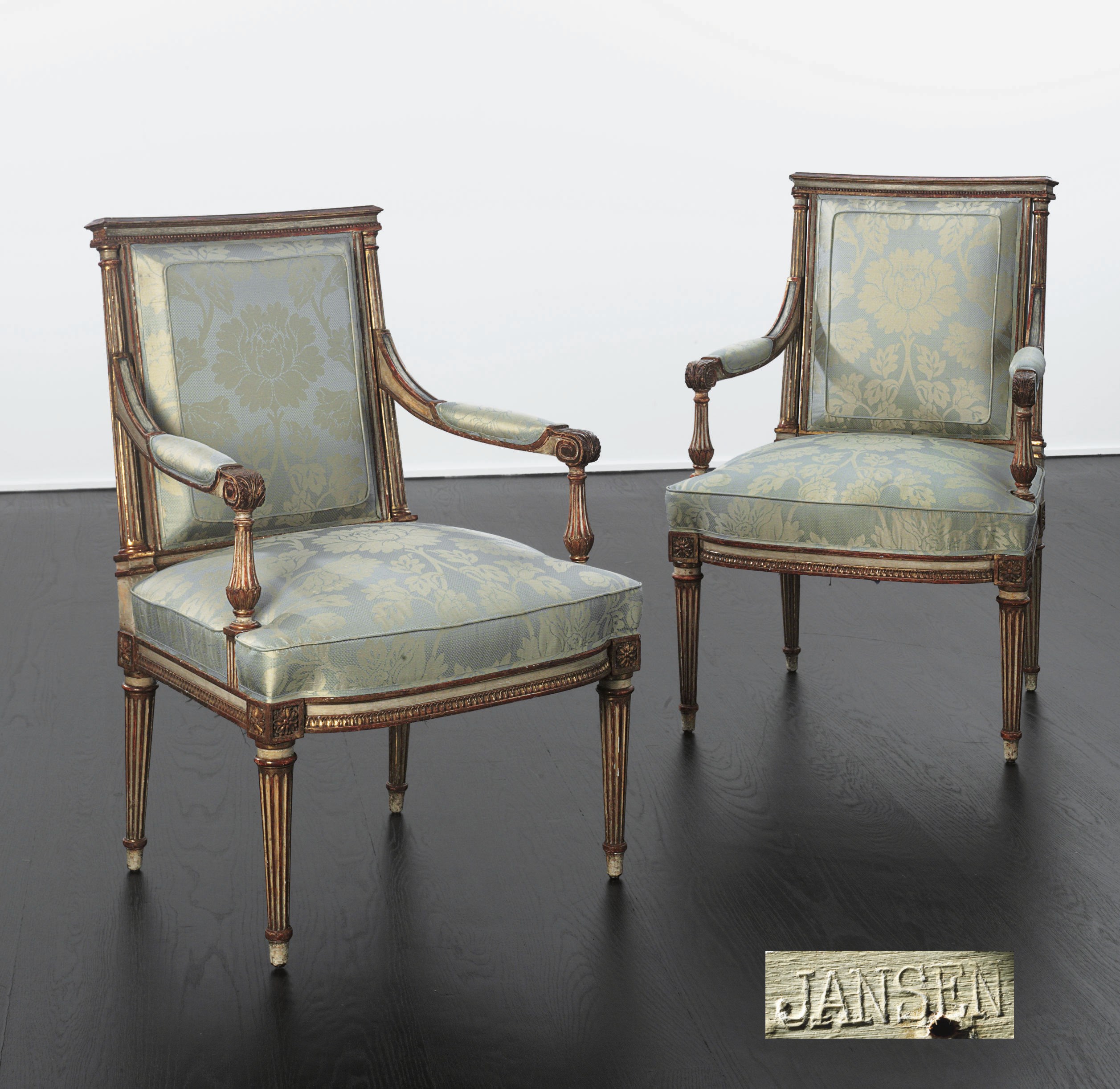 A PAIR OF FRENCH CREAM-PAINTED AND PARCEL-GILT FAUTEUILS