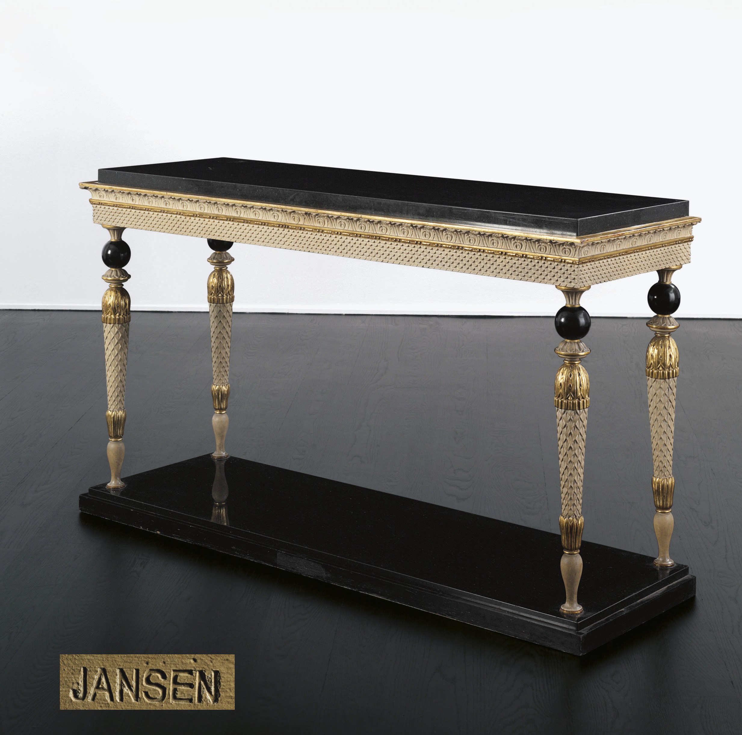 A CREAM-PAINTED, EBONIZED AND PARCEL-GILT SIDE TABLE