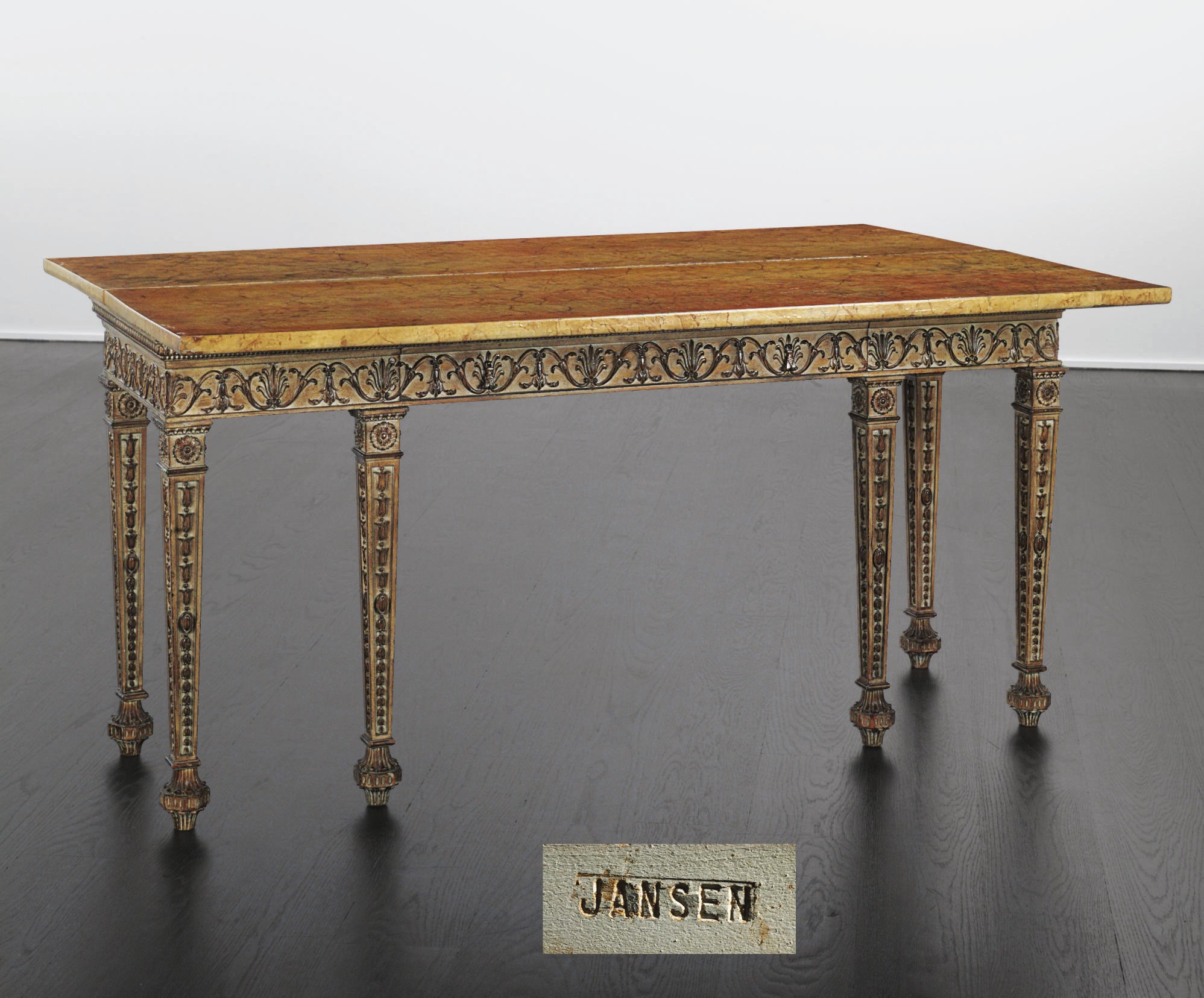 A FRENCH CREAM-PAINTED, PARCEL-GILT AND FAUX-MARBLE EXTENDING CENTER TABLE