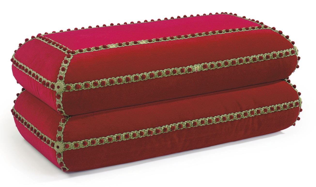 A CRIMSON VELVET-UPHOLSTERED TWO-TIER POUF