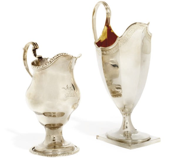 A GEORGE III SILVER HELMET CREAM JUG