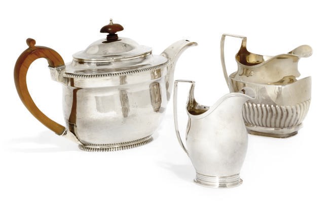 A GEORGE III BELLIED OVAL SILVER TEAPOT