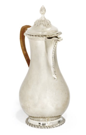 A GEORGE III SILVER HOT WATER JUG