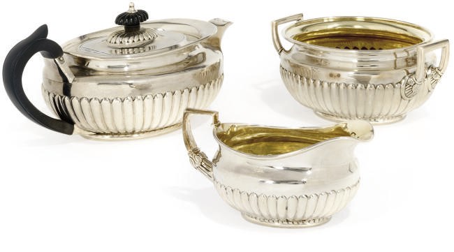 A GEORGE III SILVER THREE-PIECE TEA SET