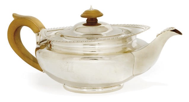A GEORGE III SILVER TEPOT