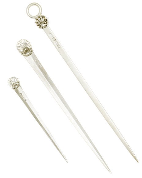 A GEORGE III SILVER MEAT SKEWER WITH CAST SHELL AND RING END