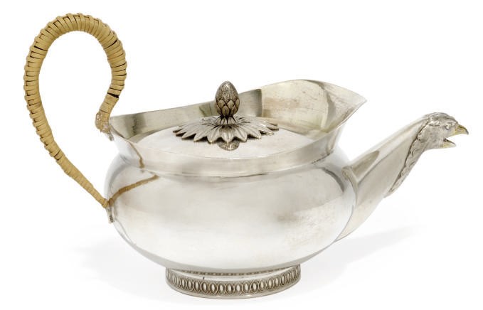 A GERMAN PARCEL-GILT SILVER TEAPOT