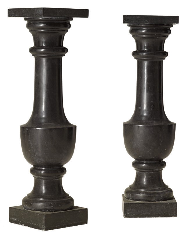 A PAIR OF BLACK MARBLE PEDESTAL COLUMNS