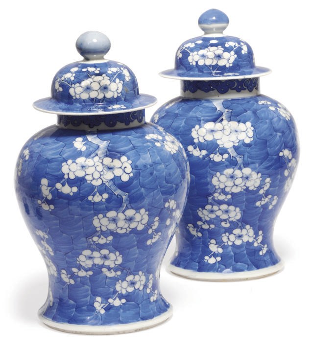 A pair of Chinese blue and white prunus jars and covers