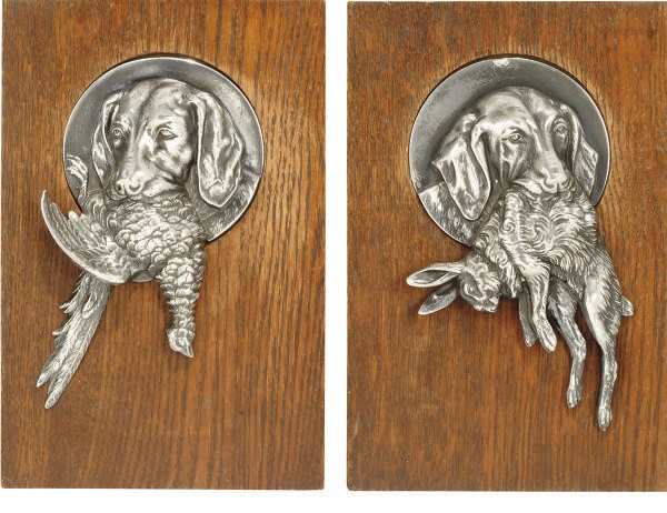 A PAIR OF GERMAN W.M.F. SILVER-PLATED PEWTER PLAQUES OF GUN DOGS