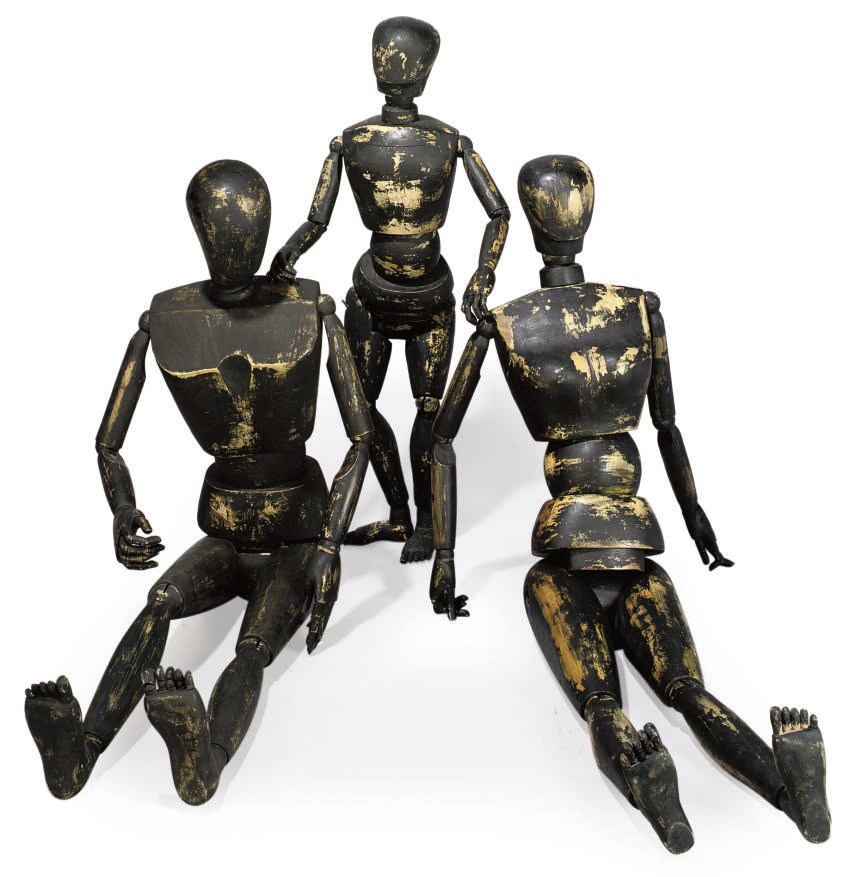 A SET OF THREE CARVED AND STAINED WOOD ARTIST'S LAY FIGURES