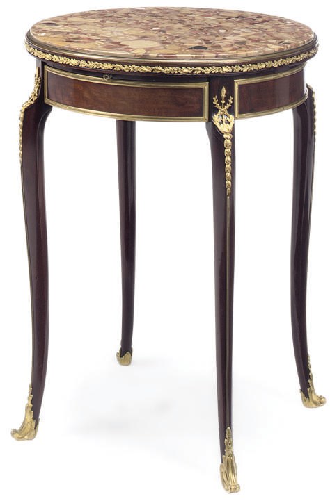 A FRENCH GILT METAL MOUNTED MAHOGANY GUERIDON