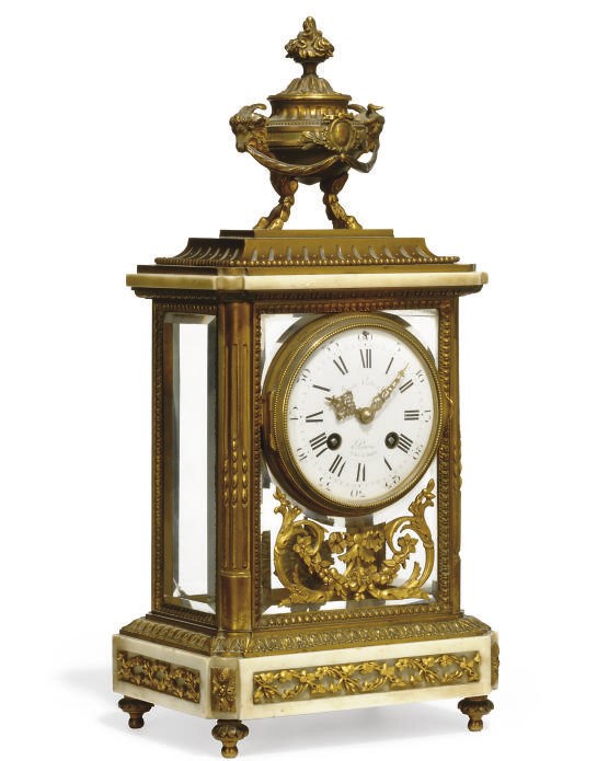 A French marble and ormolu striking eight day mantel clock