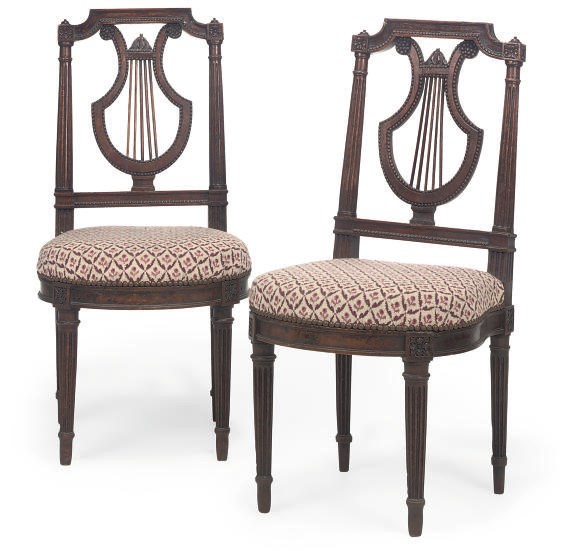 A PAIR OF NORTH EUROPEAN OAK 'DUET' CHAIRS