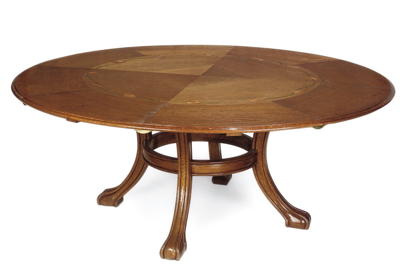 AN AMERICAN OAK AND MARQUETRY EXTENDING DINING TABLE