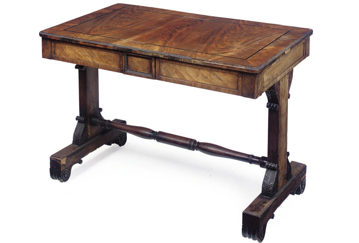 A REGENCY MAHOGANY LIBRARY TABLE