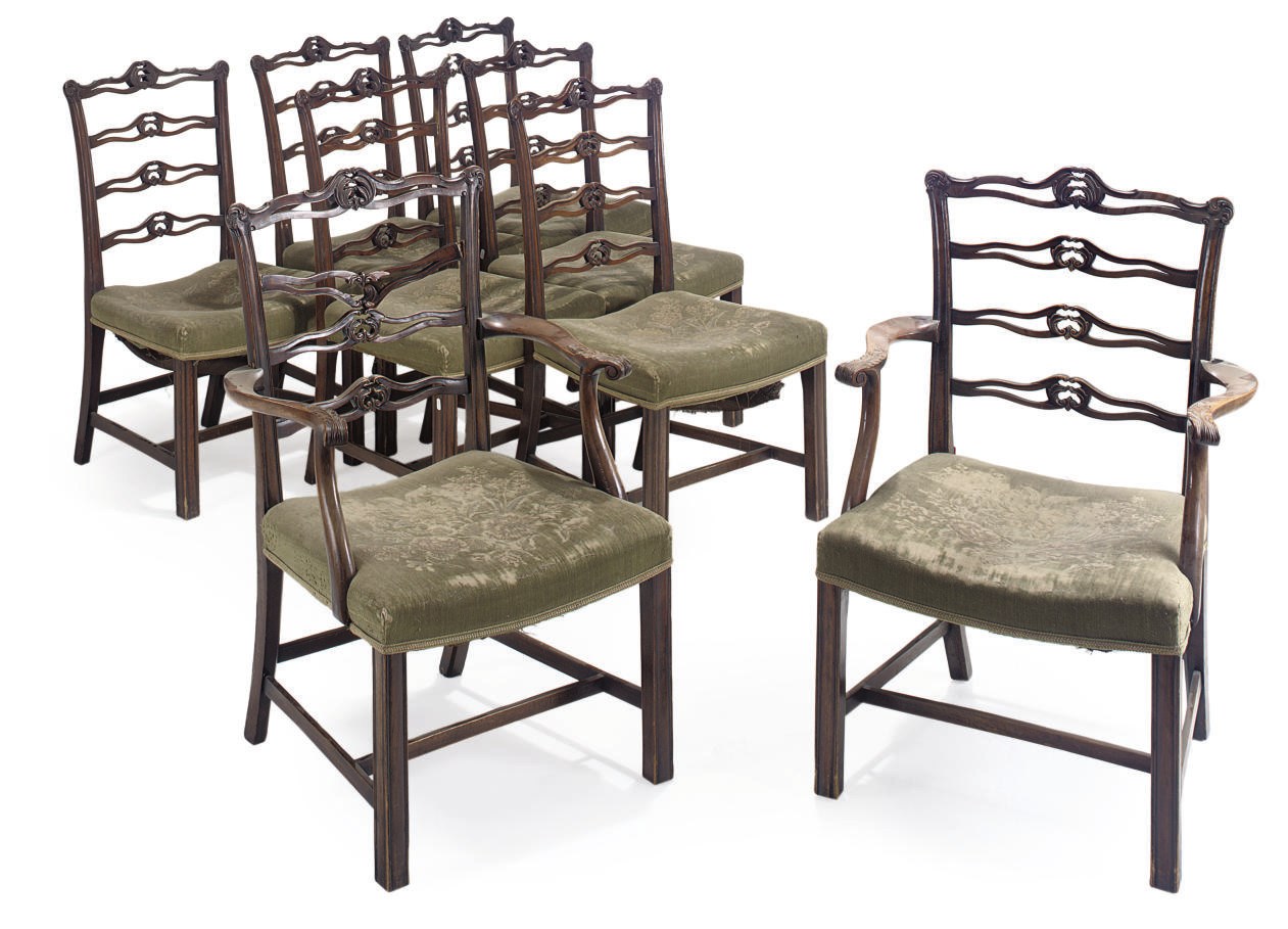 A SET OF EIGHT MAHOGANY LADDER BACK DINING CHAIRS