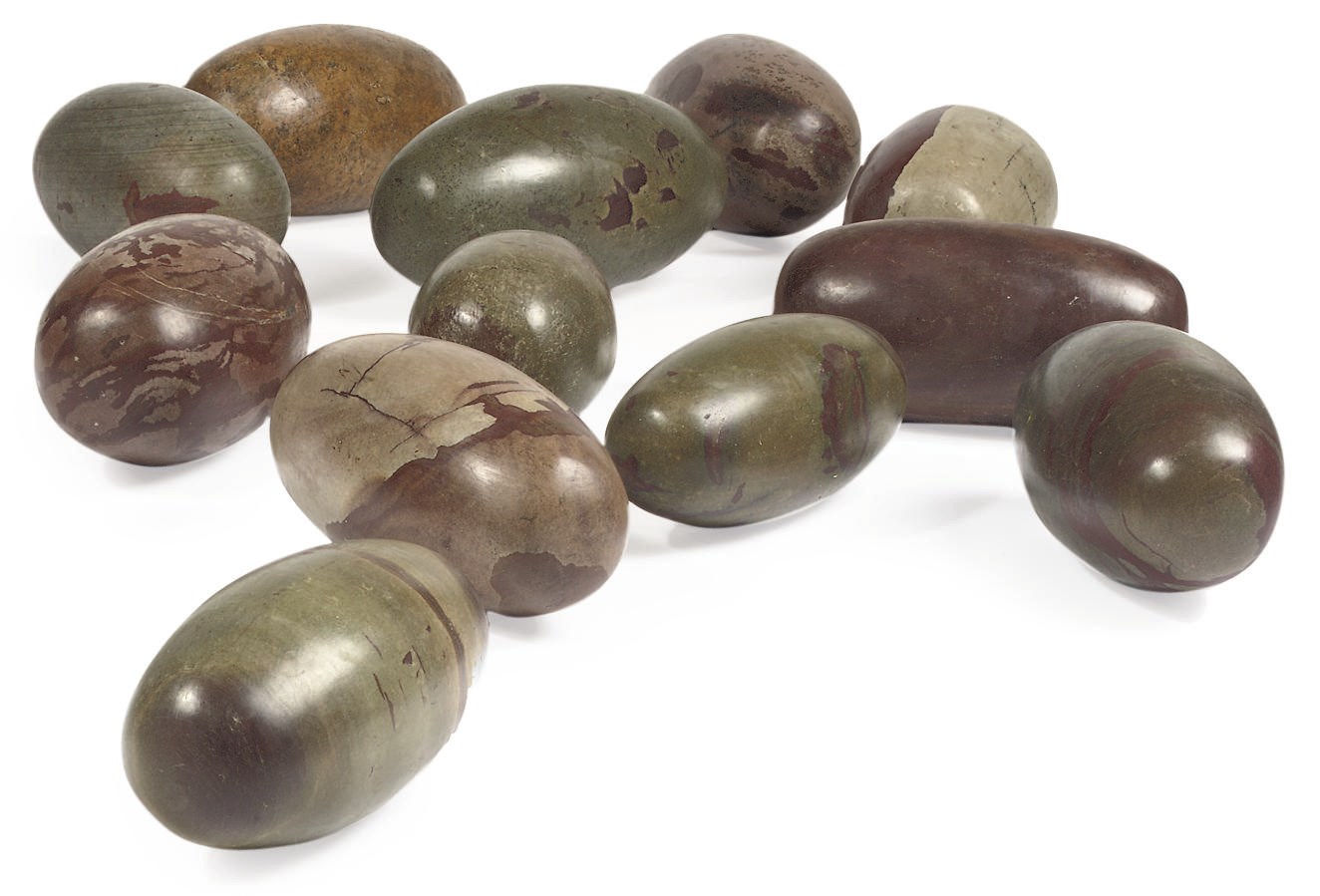 A GROUP OF TWELVE INDIAN SHIVA LINGUM STONES