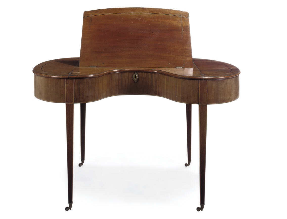 A REGENCY MAHOGANY AND BOXWOOD STRUNG KIDNEY-SHAPED DESK