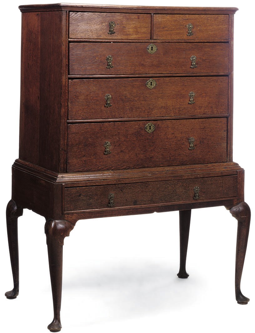 AN OAK CHEST ON STAND