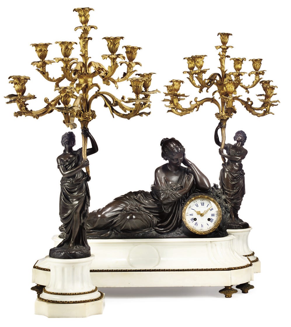 A FRENCH WHITE MARBLE AND BRONZE THREE-PIECE CLOCK GARNITURE