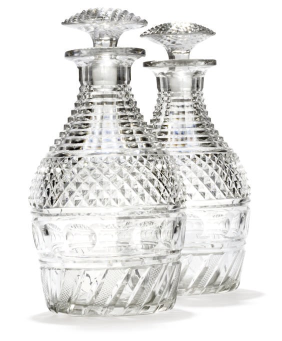 A PAIR OF CUT-GLASS DECANTERS AND STOPPERS
