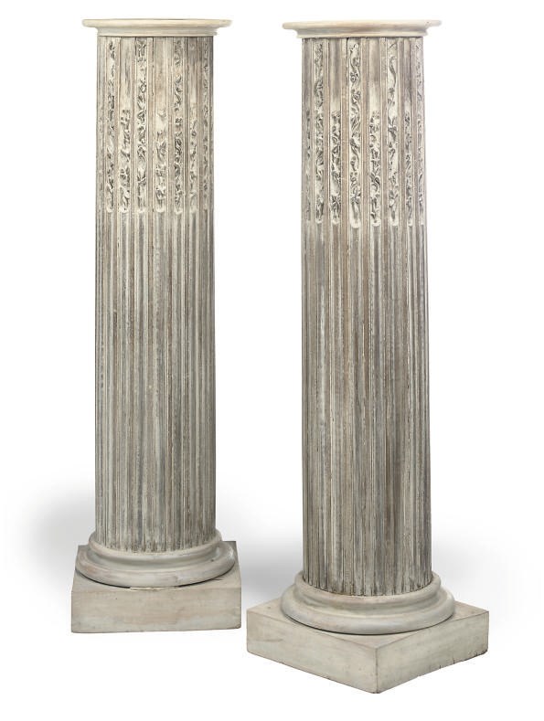A PAIR OF CARVED LIMED OAK PEDESTAL COLUMNS