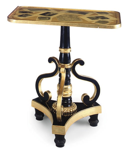 AN EBONISED AND PARCEL GILT OCCASIONAL TABLE