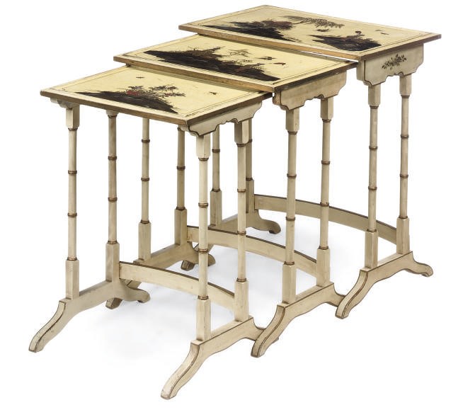 A NEST OF THREE CREAM JAPANNED OCCASIONAL TABLES