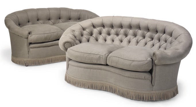A MATCHED PAIR OF KIDNEY SHAPED SOFA'S