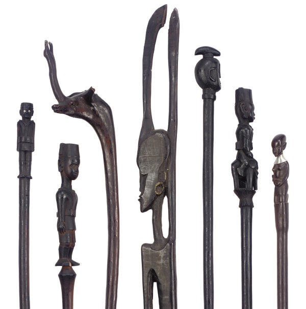 A COLLECTION OF AFRICAN CARVED WOOD WALKING STICKS AND STAFFS