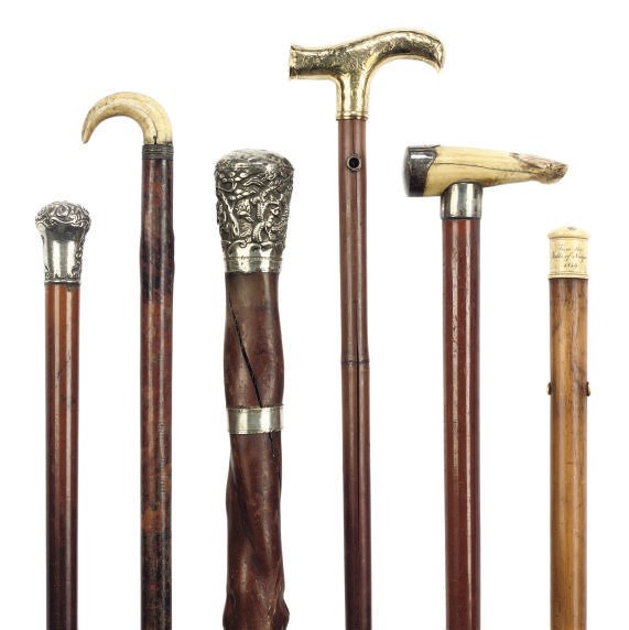 A COLLECTION OF SIX SILVER OR IVORY MOUNTED WALKING CANES