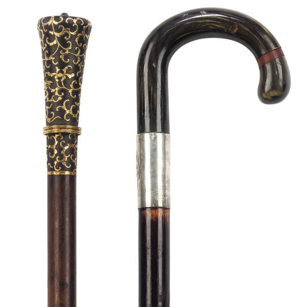 A MALACCA SWORD STICK WITH GILT AND PATINATED BRASS HANDLE