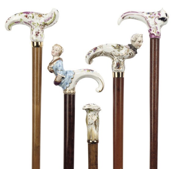 A COLLECTION OF GERMAN PORCELAIN-HANDLED WALKING STICKS