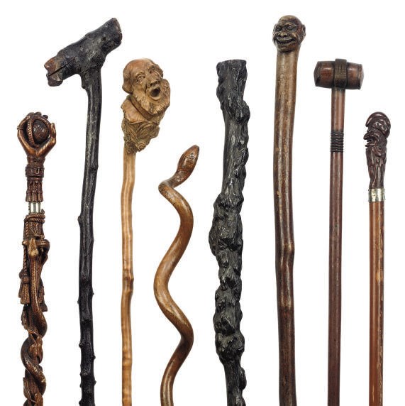 A COLLECTION OF EIGHT CARVED WOOD FOLK-ART WALKING STICKS