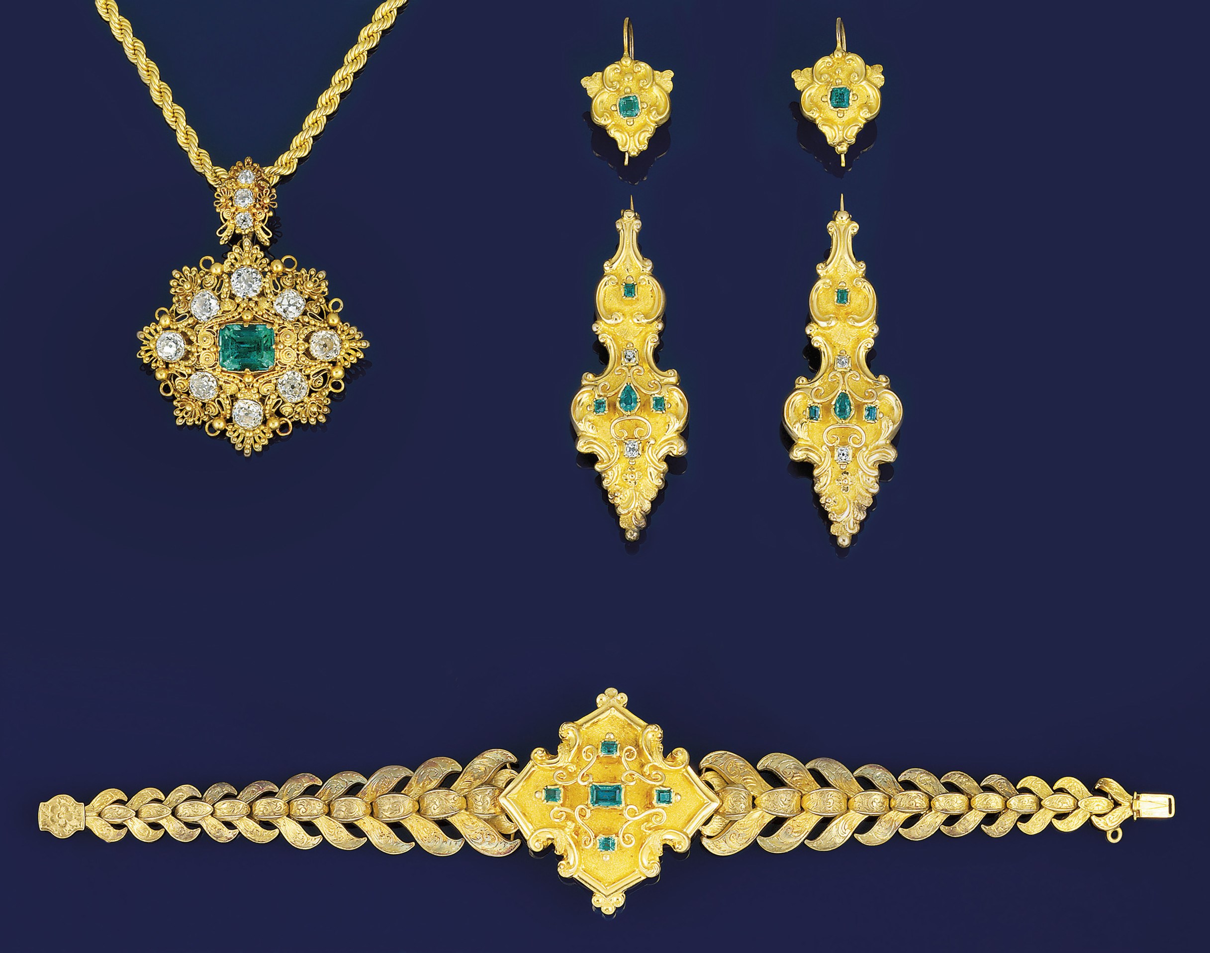 A 19th century gold, emerald and diamond brooch/pendant and a Victorian gold and emerald demi-parure
