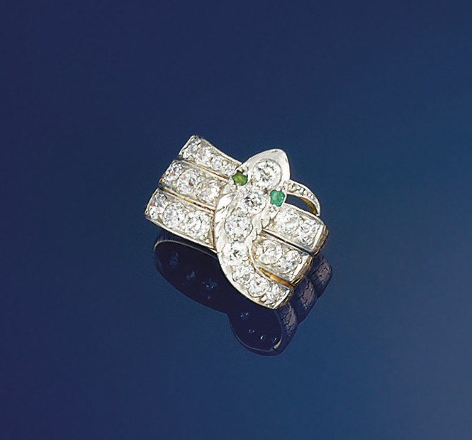 An early 20th century diamond and emerald ring