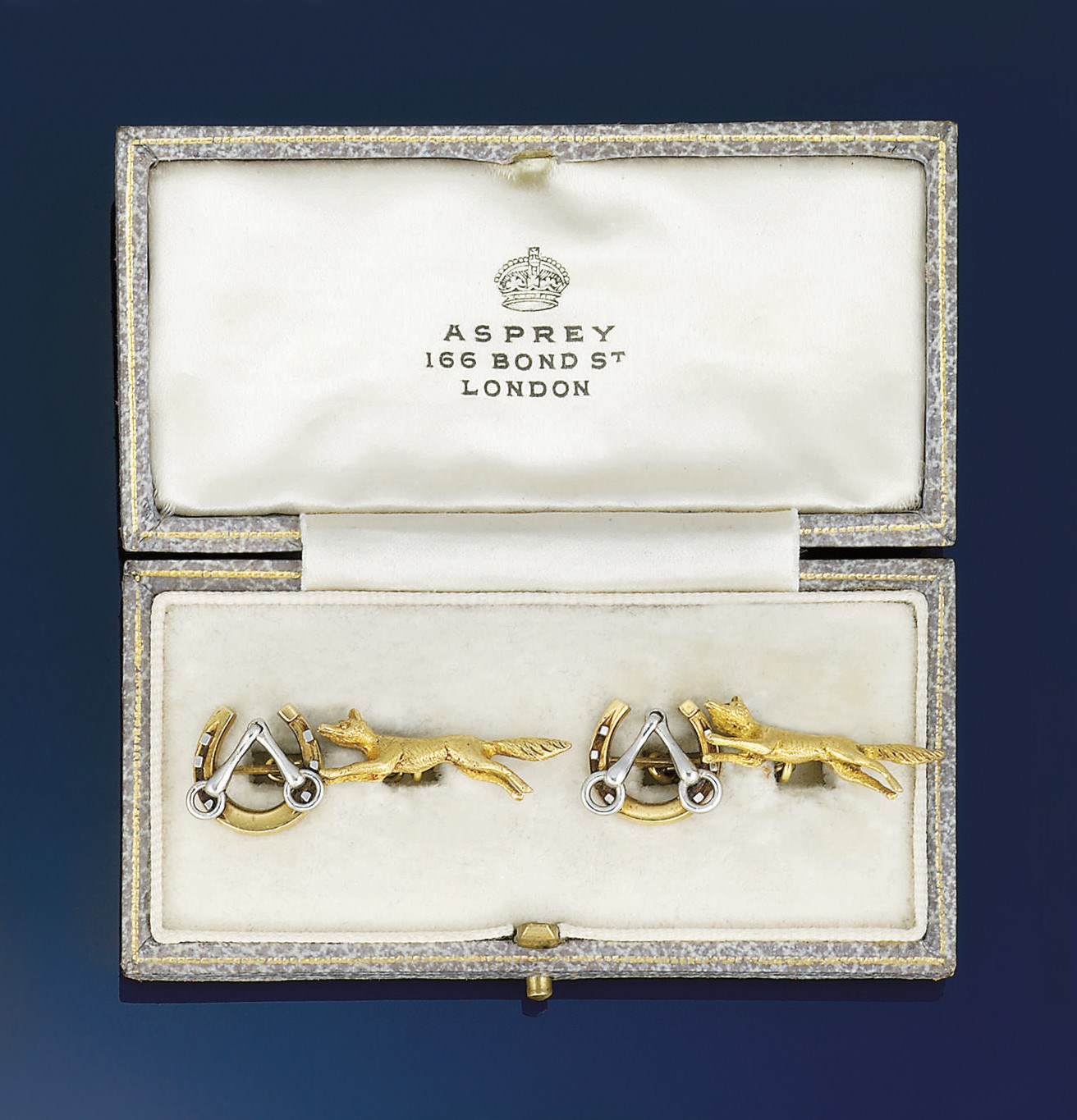 A pair of early 20th century gold sporting cufflinks