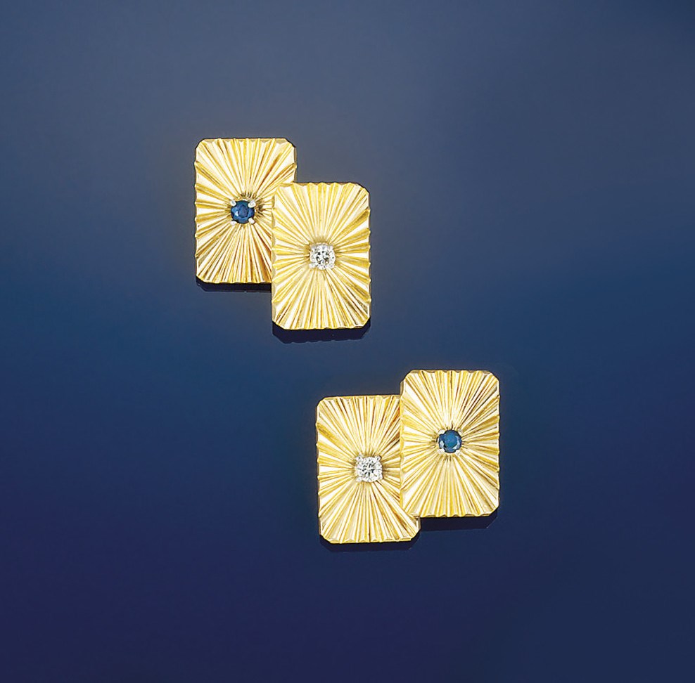 A pair of gold, diamond and sapphire 'Day and Night' cufflinks