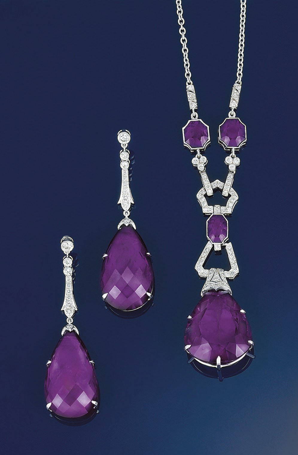 An amethyst and diamond pendant and earrings