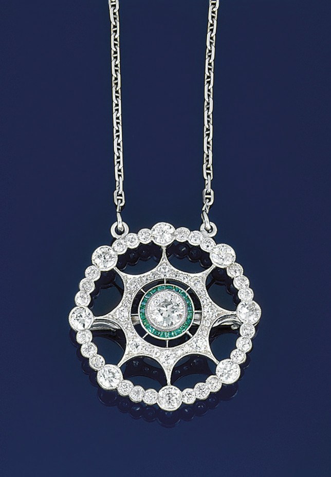 A diamond and emerald pendant necklace