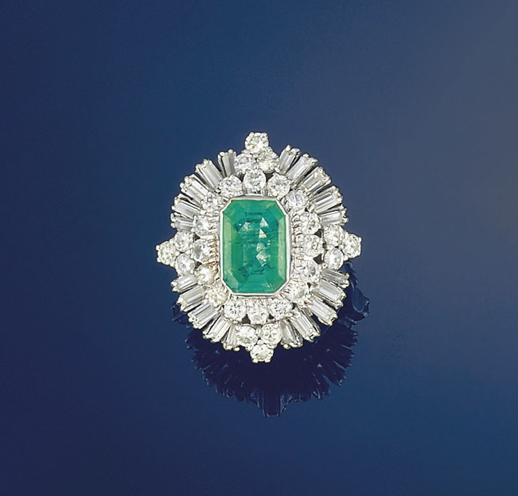An emerald and diamond ring
