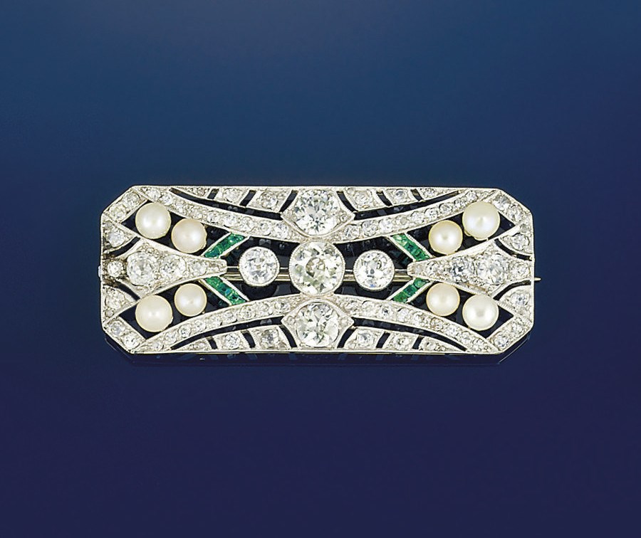 An early 20th century diamond, pearl and emerald brooch