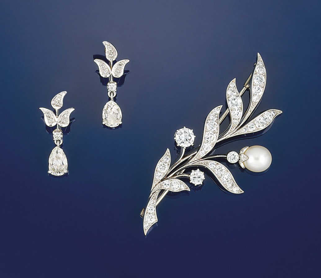 A diamond and cultured pearl brooch and a pair of diamond earrings