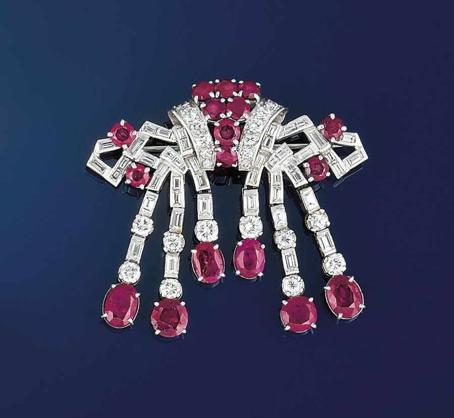 An art deco diamond and ruby tassel brooch